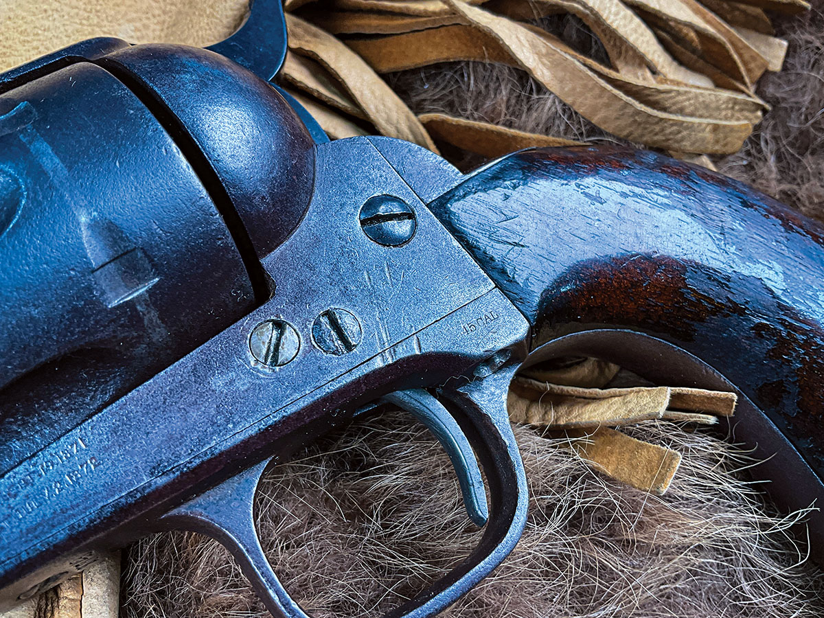 Typical of this era, the cartridge is stamped on the trigger guard.